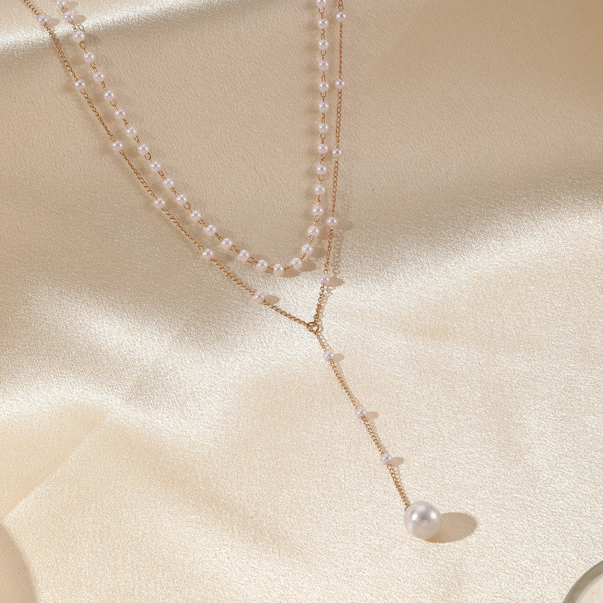Collier double couche de perles jumelles