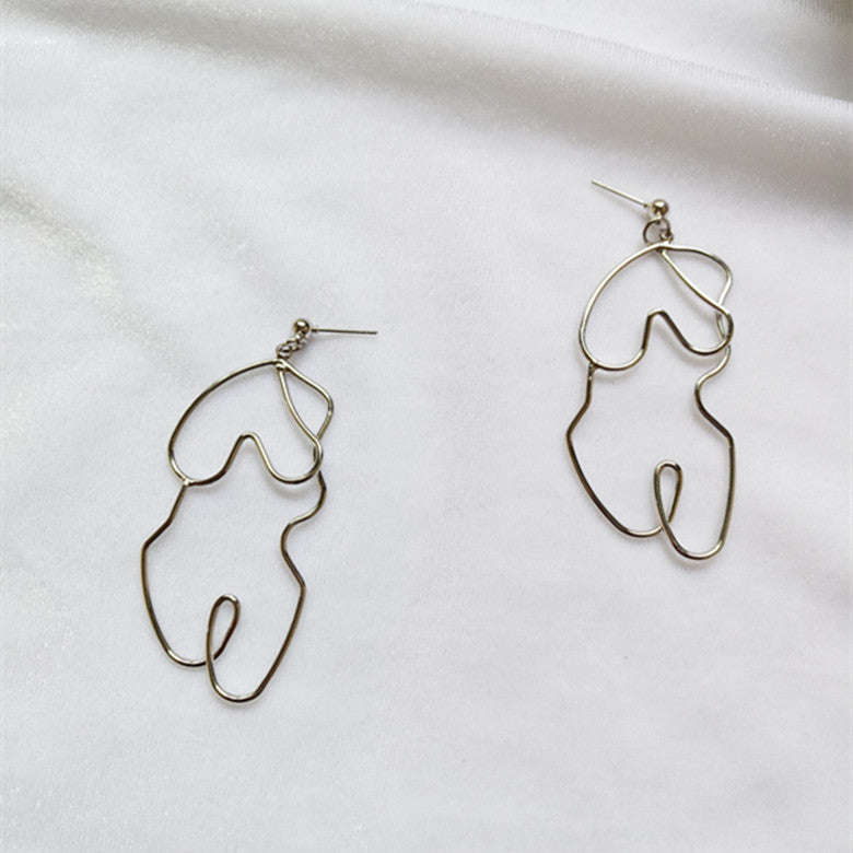 Boucles d'oreilles Twistées Oversize – Élégance audacieuse pour briller en toute confiance