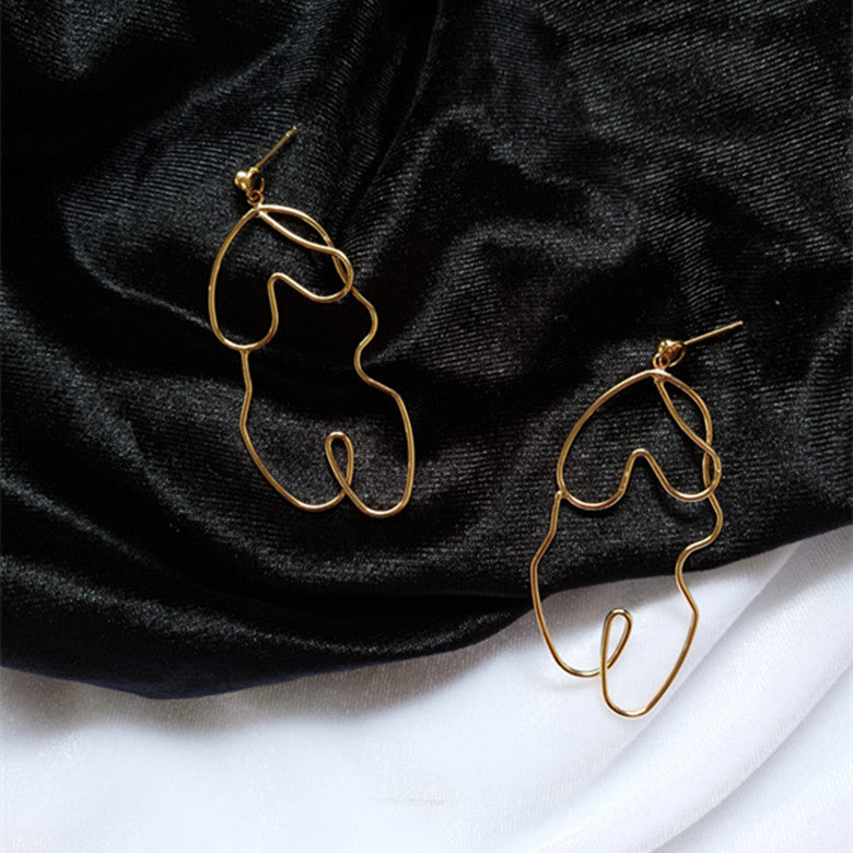 Boucles d'oreilles Twistées Oversize – Élégance audacieuse pour briller en toute confiance