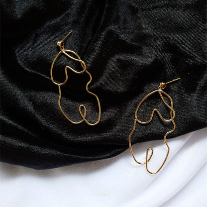 Boucles d'oreilles Twistées Oversize – Élégance audacieuse pour briller en toute confiance