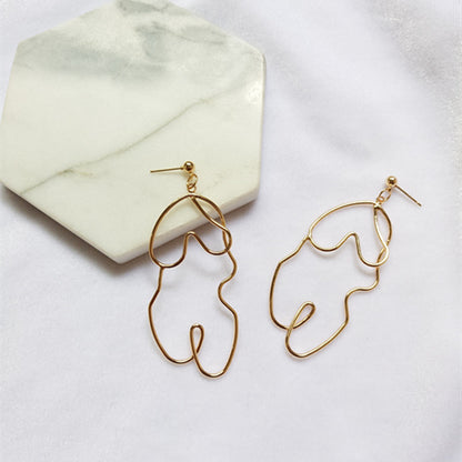 Boucles d'oreilles Twistées Oversize – Élégance audacieuse pour briller en toute confiance